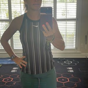 Nike tennis or athletic top, black white and gray striped top. Size small